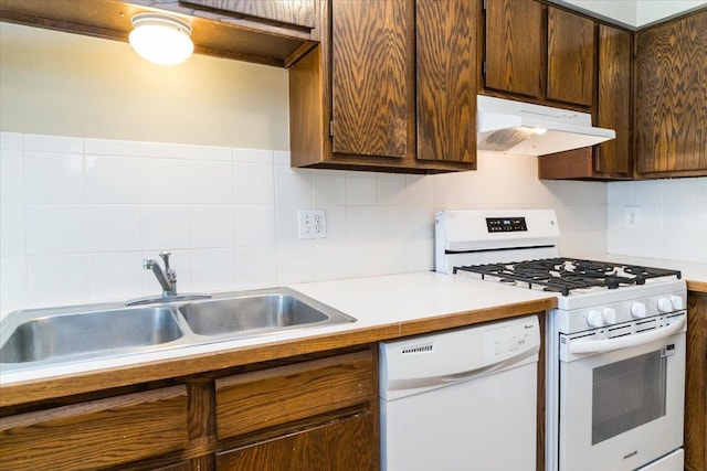 10382 Juniper Ln, Eden Prairie, MN 55347 - kitchen featuring white appliances, under cabinet range hood, light countertops, and tasteful backsplash