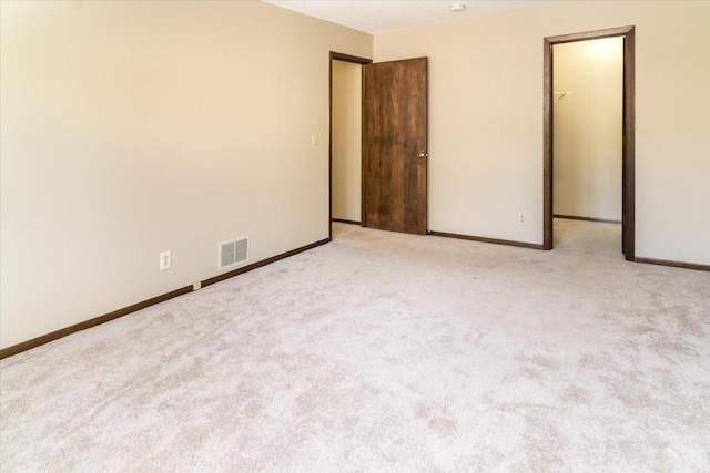 10382 Juniper Ln, Eden Prairie, MN 55347 - unfurnished bedroom with a walk in closet and carpet