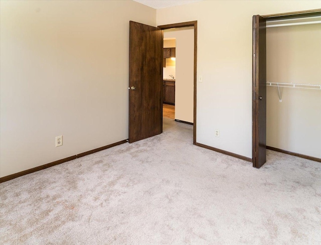 10382 Juniper Ln, Eden Prairie, MN 55347 - unfurnished bedroom featuring carpet floors and a closet