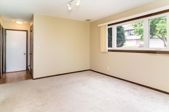 10382 Juniper Ln, Eden Prairie, MN 55347 - spare room with light colored carpet and baseboards