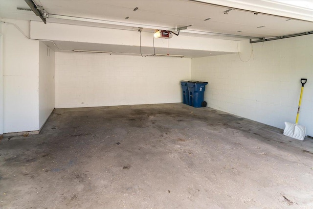10382 Juniper Ln, Eden Prairie, MN 55347 - garage with a garage door opener and concrete block wall