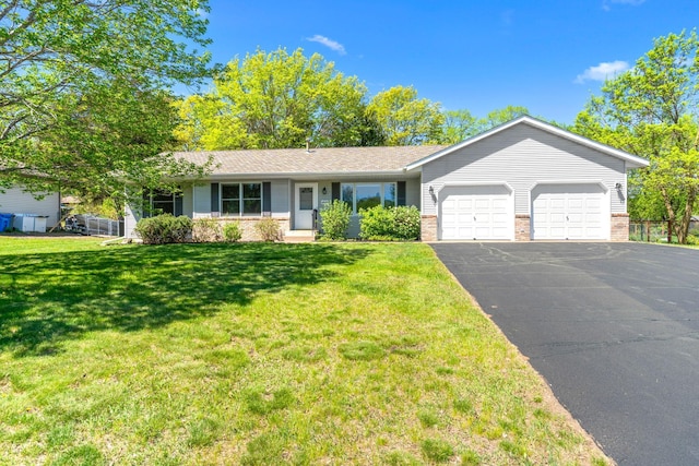 39094 Riverside Ct, North Branch, MN 55056 - single story home featuring an attached garage, brick siding, asphalt driveway, and a front yard