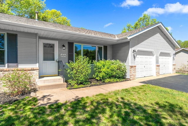 39094 Riverside Ct, North Branch, MN 55056 - single story home with an attached garage, driveway, roof with shingles, and a front yard