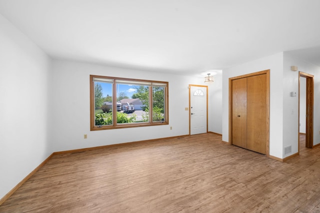 39094 Riverside Ct, North Branch, MN 55056 - spare room featuring wood finished floors and baseboards
