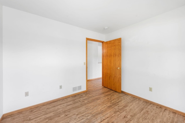 39094 Riverside Ct, North Branch, MN 55056 - empty room featuring wood finished floors and baseboards