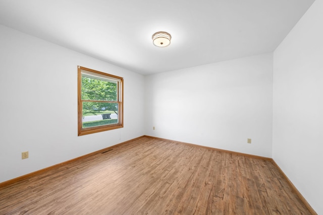 39094 Riverside Ct, North Branch, MN 55056 - empty room with wood finished floors and baseboards