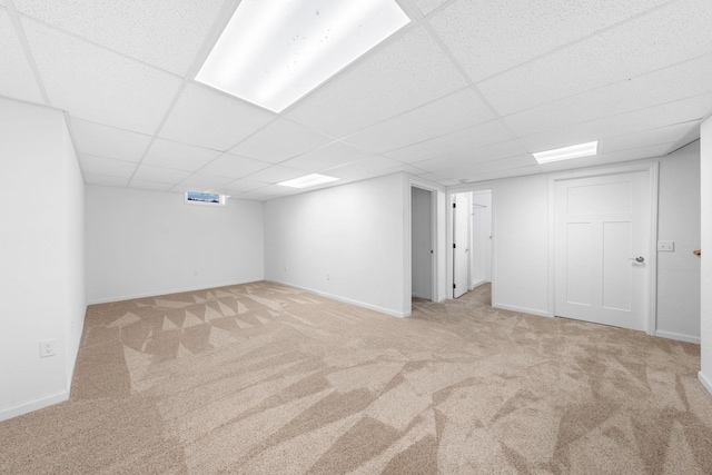 39094 Riverside Ct, North Branch, MN 55056 - finished basement featuring light colored carpet, a paneled ceiling, and baseboards