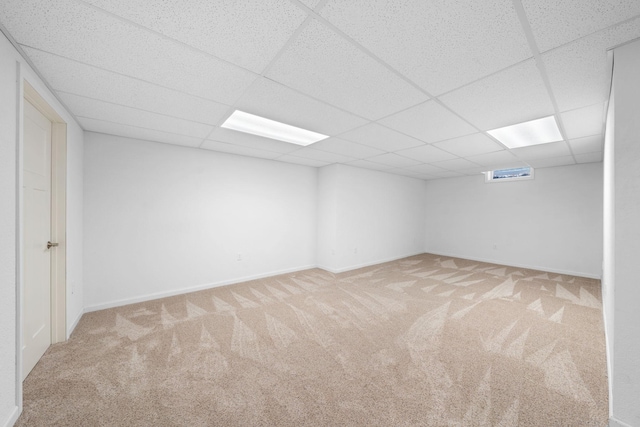 39094 Riverside Ct, North Branch, MN 55056 - basement featuring a drop ceiling, carpet, and baseboards