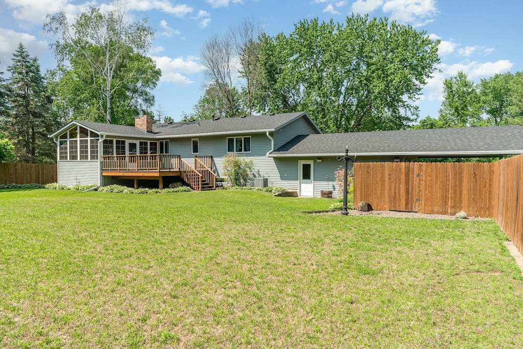 897 Willow Ridge Rd, Hudson, WI 54016 - rear view of property featuring a deck, a chimney, and a sunroom