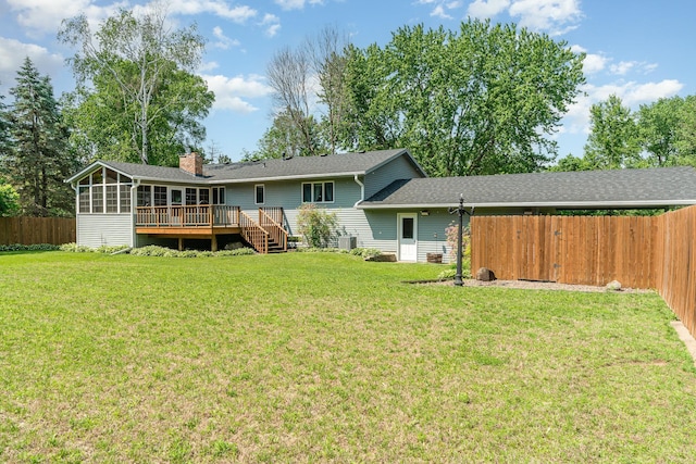 897 Willow Ridge Rd, Hudson, WI 54016 - rear view of property featuring a deck, a chimney, and a sunroom