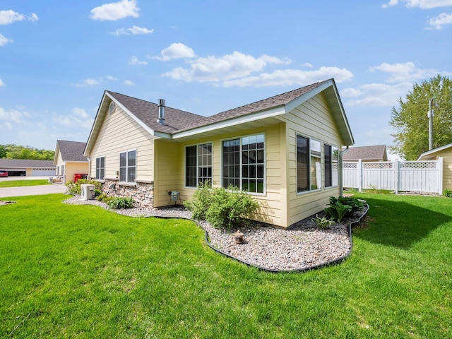 116 Street Cir Unit 104, Miltona, MN 56354 - rear view of house featuring roof with shingles