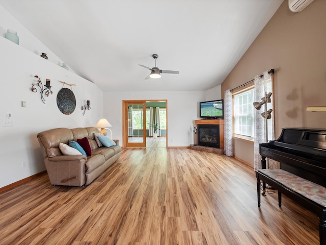 116 Street Cir Unit 104, Miltona, MN 56354 - living room with vaulted ceiling, light wood-type flooring, healthy amount of natural light, and a glass covered fireplace
