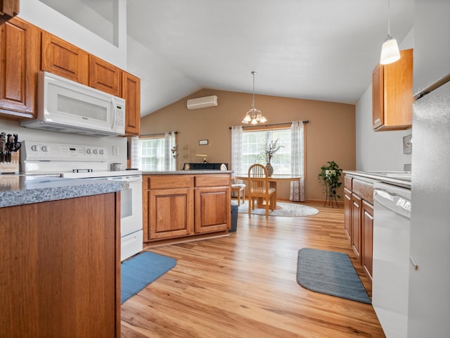 116 Street Cir Unit 104, Miltona, MN 56354 - kitchen featuring white appliances, light wood-style flooring, a chandelier, a wall mounted air conditioner, and vaulted ceiling