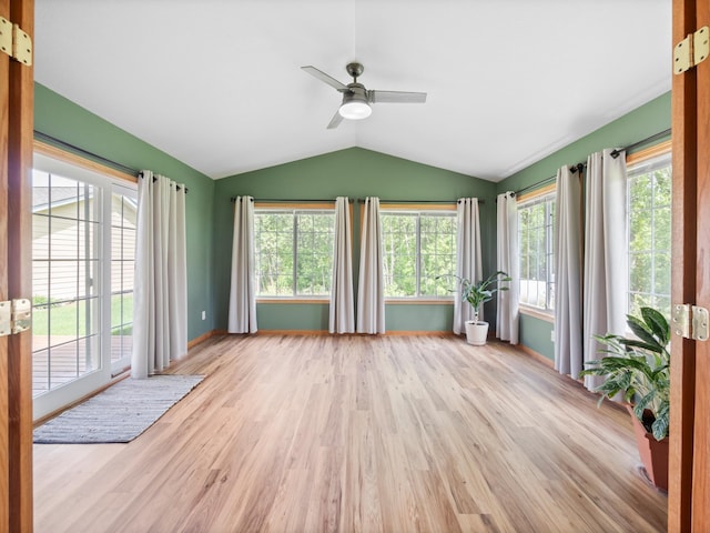 116 Street Cir Unit 104, Miltona, MN 56354 - unfurnished sunroom featuring lofted ceiling, plenty of natural light, wood finished floors, baseboards, and french doors