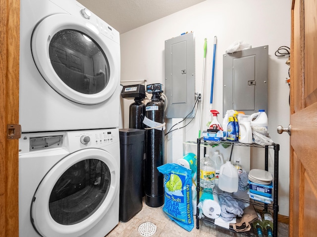 116 Street Cir Unit 104, Miltona, MN 56354 - laundry area with stacked washer / drying machine, electric panel, and tile patterned flooring