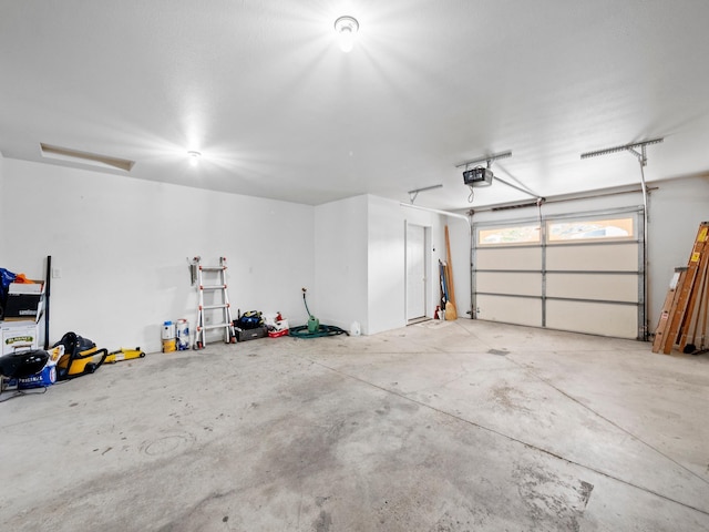 116 Street Cir Unit 104, Miltona, MN 56354 - garage featuring a garage door opener
