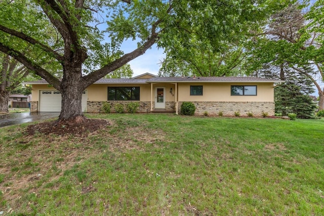 ranch-style home featuring a garage, brick siding, driveway, and a front lawn