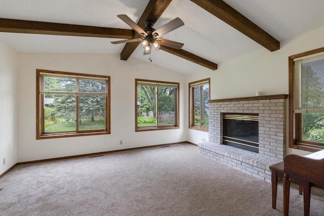 unfurnished living room with carpet floors, plenty of natural light, and baseboards