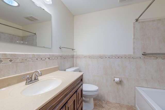 full bathroom featuring tile walls, toilet, a shower, a tub, and vanity