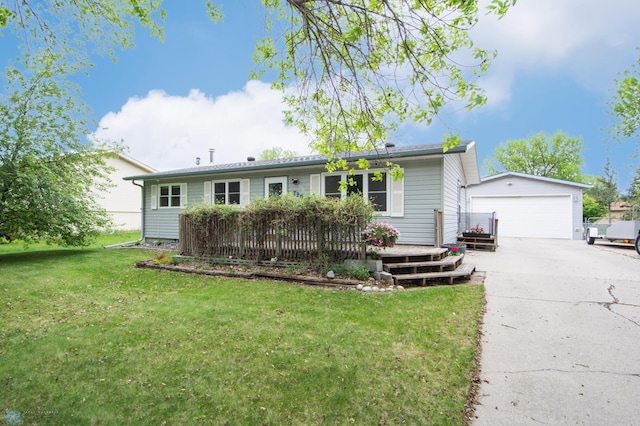 single story home featuring an outdoor structure, a detached garage, a wooden deck, and a front lawn