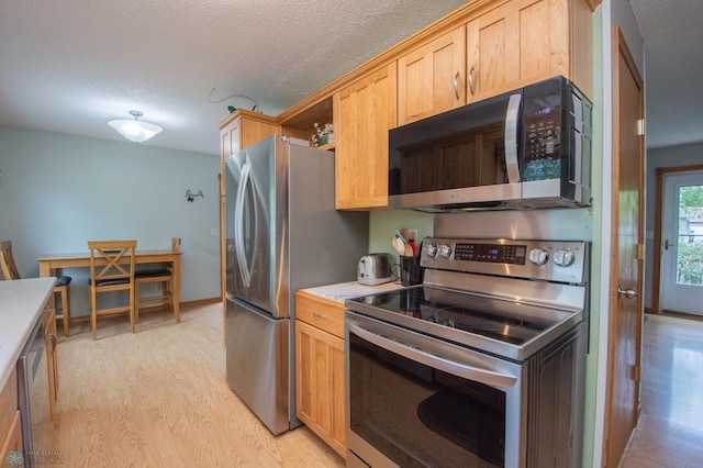 kitchen featuring stainless steel appliances, a textured ceiling, light wood-type flooring, light countertops, and open shelves