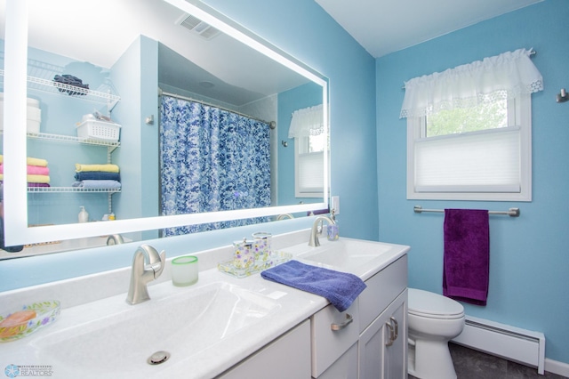 bathroom featuring a baseboard heating unit, double vanity, toilet, and a shower with curtain