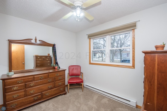 bedroom with a baseboard radiator, light carpet, a textured ceiling, and a ceiling fan
