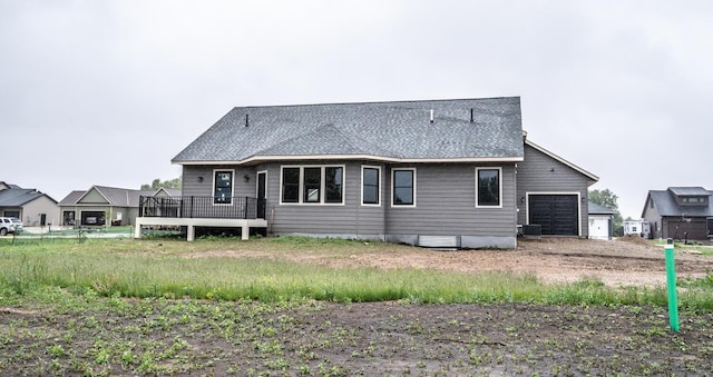 29194 Cynthia Path, Randolph, MN 55065 - back of house with an attached garage, a wooden deck, central AC, and roof with shingles