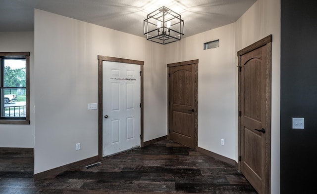 29194 Cynthia Path, Randolph, MN 55065 - entrance foyer with a chandelier, dark wood-style floors, and baseboards