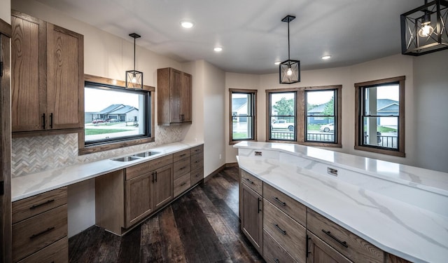 29194 Cynthia Path, Randolph, MN 55065 - kitchen featuring dark wood-style flooring, decorative backsplash, light stone countertops, decorative light fixtures, and recessed lighting