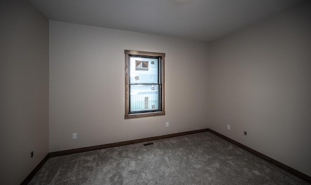 29194 Cynthia Path, Randolph, MN 55065 - empty room featuring dark carpet and baseboards