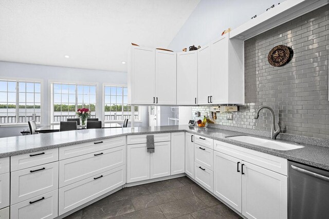 23324 Tioga Beach Rd, Cohasset, MN 55721 - kitchen featuring dishwasher, a sink, white cabinetry, decorative backsplash, and recessed lighting