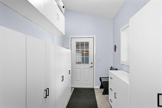 23324 Tioga Beach Rd, Cohasset, MN 55721 - washroom featuring a textured ceiling