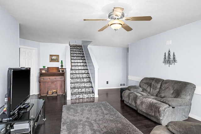 23324 Tioga Beach Rd, Cohasset, MN 55721 - living room with ceiling fan, stairs, baseboards, and wood finished floors
