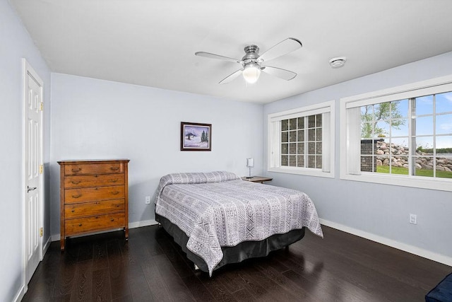 23324 Tioga Beach Rd, Cohasset, MN 55721 - bedroom featuring baseboards, dark wood-style floors, and ceiling fan