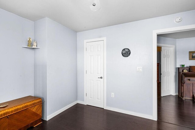 23324 Tioga Beach Rd, Cohasset, MN 55721 - empty room featuring wood-type flooring, a smoke detector, and baseboards