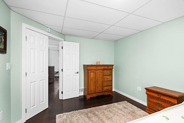 23324 Tioga Beach Rd, Cohasset, MN 55721 - bedroom featuring a paneled ceiling, wood finished floors, and baseboards