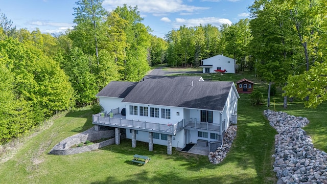 23324 Tioga Beach Rd, Cohasset, MN 55721 - back of property featuring a lawn, a wooden deck, and roof with shingles