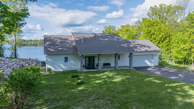 23324 Tioga Beach Rd, Cohasset, MN 55721 - view of front facade with a front lawn, a garage, driveway, roof with shingles, and french doors