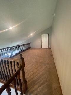 5611 Bavarian Pass, Fridley, MN 55432 - additional living space featuring carpet and lofted ceiling