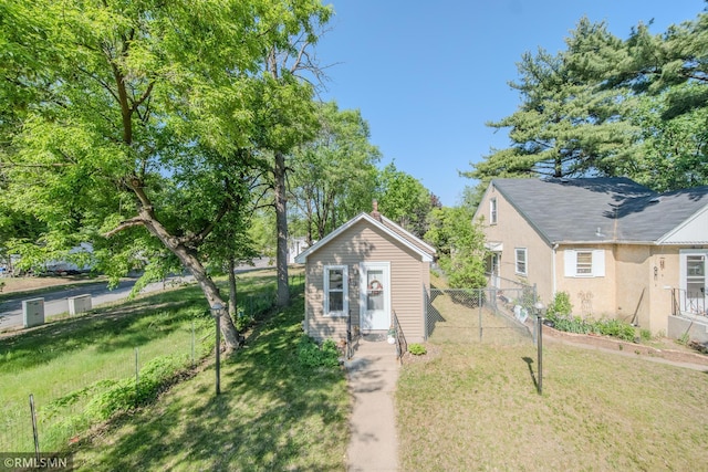 view of front of house with an outbuilding