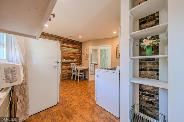 kitchen featuring range, recessed lighting, and freestanding refrigerator