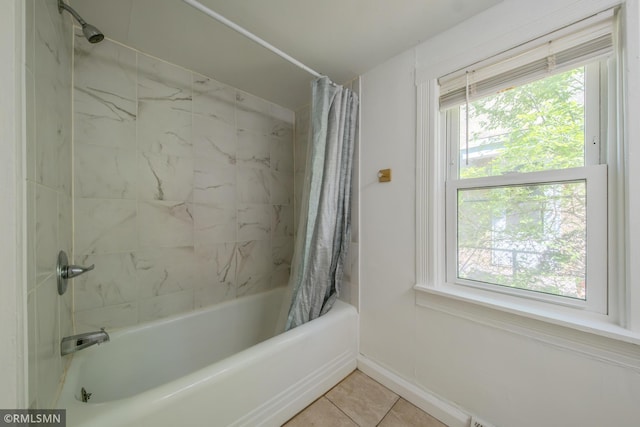 full bath with shower / tub combo, baseboards, and tile patterned flooring