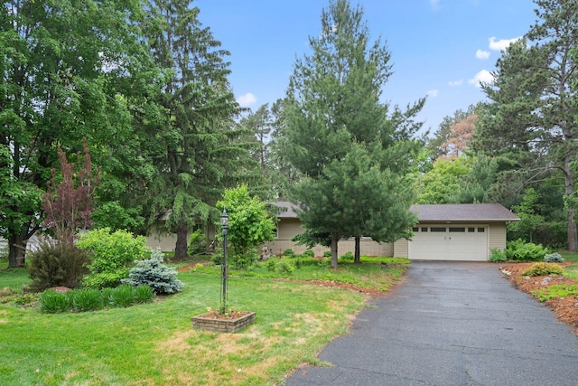 14 Overlook Rd, Dellwood, MN 55110 - obstructed view of property featuring driveway, a front yard, and a garage