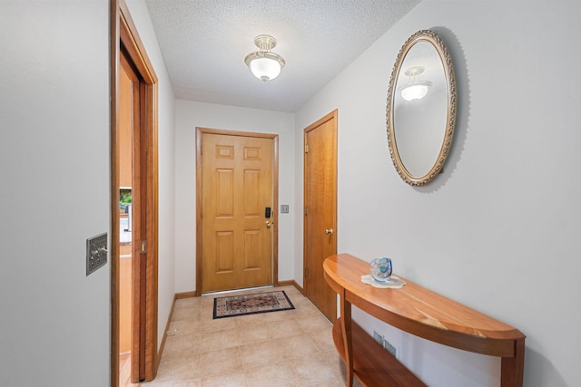 14 Overlook Rd, Dellwood, MN 55110 - doorway featuring baseboards and a textured ceiling