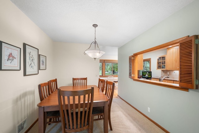 14 Overlook Rd, Dellwood, MN 55110 - dining area featuring light carpet and baseboards
