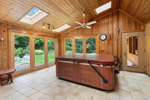 14 Overlook Rd, Dellwood, MN 55110 - sunroom / solarium with a skylight, a hot tub, vaulted ceiling, french doors, and rail lighting