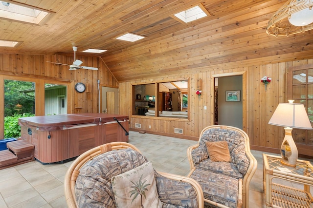 14 Overlook Rd, Dellwood, MN 55110 - living room with a skylight, vaulted ceiling, wood walls, wood ceiling, and light tile patterned flooring