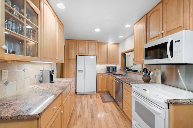 14 Overlook Rd, Dellwood, MN 55110 - kitchen with white appliances, a sink, light wood finished floors, decorative backsplash, and glass insert cabinets