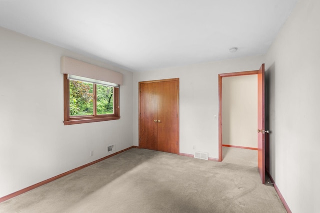 14 Overlook Rd, Dellwood, MN 55110 - unfurnished bedroom featuring carpet, a closet, and baseboards